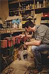 Carpenter working on his craft in a dusty workshop