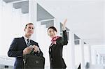 Japanese attractive flight attendant helping customer at the airport