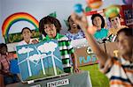 A class of children at a Green Science Fair event, with presentations on solar power and recycling.