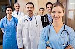 Medical team smiling at camera together at the hospital