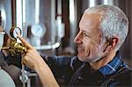 Happy brewer working in the plant at the local brewery