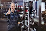 Happy brewer working in the plant at the local brewery