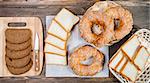 Different types of bread on a wooden background