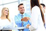 Business people shaking hands, finishing up a meeting