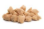 Soya chunks isolated on white background. Closeup.