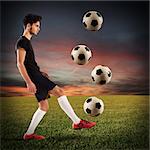 Teenage soccer player dribbling with four soccerball