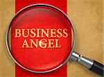 Business Angel through Loupe on Old Paper with Red Vertical Line Background. 3d Render.