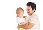 Asian grandmother taking care grandchild, isolated on white background.