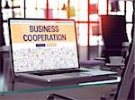 Business Cooperation Concept Closeup on Landing Page of Laptop Screen in Modern Office Workplace. Toned Image with Selective Focus. 3D Render.