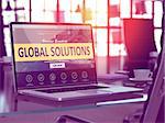 Global Solutions Concept Closeup on Laptop Screen in Modern Office Workplace. Toned Image with Selective Focus. 3D Render.