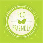 eco friendly with leaf sign in circle with rings over green old paper background