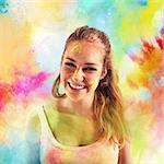 Laughing girl on background of colored powders