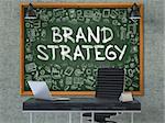 Hand Drawn Brand Strategy on Green Chalkboard. Modern Office Interior. Gray Concrete Wall Background. Business Concept with Doodle Style Elements. 3D.