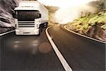 Truck on road in a natural landscape