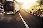 Bus driving on road with landscape background