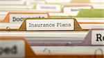 File Folder Labeled as Insurance Plans in Multicolor Archive. Closeup View. Blurred Image. 3D Render.