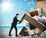 Man moves office furniture from the beach