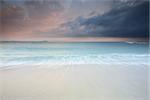 The pastel soft flows of waves at Windang Island from a 1/2 second exposure creating the feeling of movement, and views north to Wollongong with heavy cloud coming in from the east.