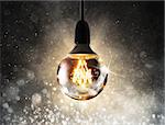 Big light bulb shining with sparkling background