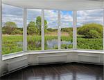 window overlooking the landscape with summer pond