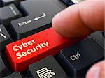 Cyber Security - Written on Red Keyboard Key. Male Hand Presses Button on Black PC Keyboard. Closeup View. Blurred Background.