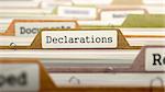 Declarations on Business Folder in Multicolor Card Index. Closeup View. Blurred Image. 3D Render.