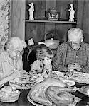 1950s FAMILY THANKSGIVING DINNER PRAYING GIRL AND GRANDPARENTS