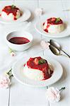 Mini cheesecakes with strawberry sauce