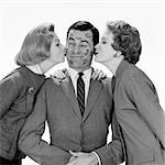 1950s 1960s SINGLE MAN BEING KISSED BY TWO WOMEN