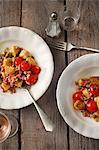 Roasted gnocchi with bacon, leek and tomatoes