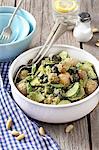 Potato salad with new potatoes, courgettes, olives, almonds and pesto