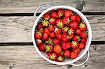 Fresh strawberries in a colander (seen from above)