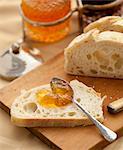 Marmalade spread on a slice of homemade bread