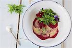 Beetroot carpaccio with a herb salad