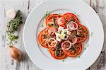 Tomato salad with anchovies and feta cheese