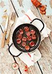 Fried chorizo slices in a pan