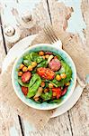 Spinach salad with spicy roasted chickpeas and chorizo