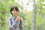 Young Japanese woman at a camp site