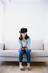 Japanese woman using virtual reality device