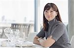 Portrait smiling businesswoman at restaurant table