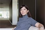 Portrait confident businesswoman on sofa