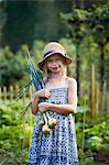 Portrait of girl holding onions