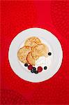 Pancakes with fruits on plate