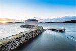 Wooden building on stone jetty