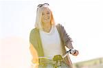 Portrait smiling senior woman bike riding