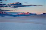 Tranquil white sand dune and mountains at sunset, White Sands, New Mexico, United States