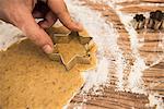 Close-up of a man cutting out star shape cookies, Munich, Bavaria, Germany