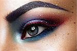 Close-up of beautiful womanish eye. Colored eyeshadows
