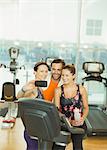 Friends taking selfie at gym