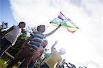 Happy children playing with a kite